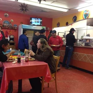 a group of people in a restaurant