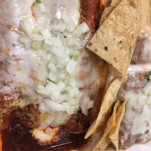 Ground beef enchiladas with red sauce. I added the onions. Will come eat this again. YES.