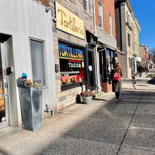 a woman walking down the street