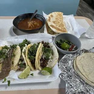 Grande Asada Taco, Grande beef Tacos, menudo, and chicken quesadilla.