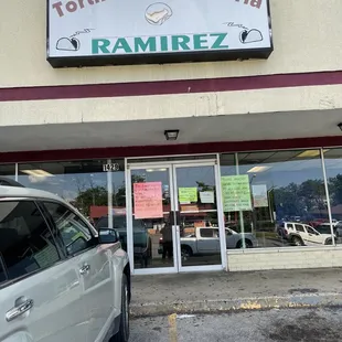 a car parked in front of a restaurant