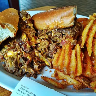 a plate of food with a sandwich and french fries