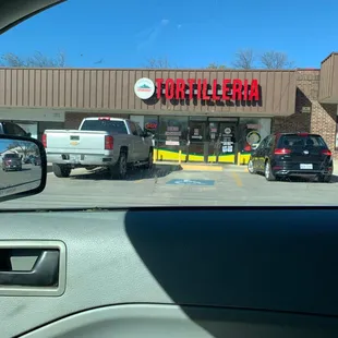 a view of a store from inside a car