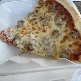 Slice of sausage pizza.