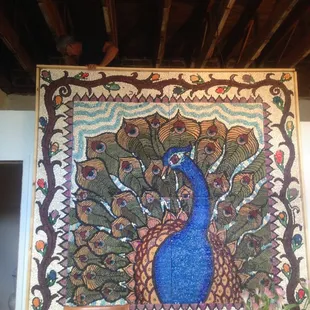 Peacock Seed Mural by Local Treasure, Jade Leyva is on display at Tortuga September 2-17
