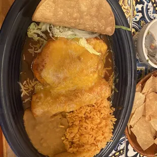 Combo taco enchilada and chilie relain with rice and beans