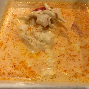 a bowl of soup with a spoon in it