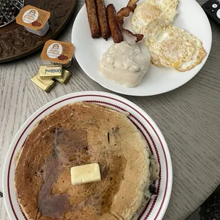 GINORMOUS dinner plate-sized blueberry pancakes, links, biscuit &amp; gravy, eggs over medium.  Oh - and a piece of hubby&apos;s bacon. Wow. 060824