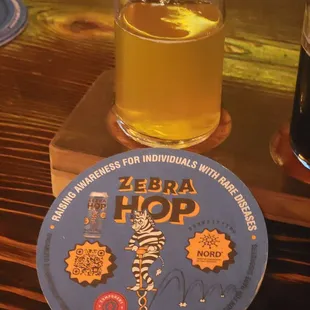 a glass of beer and coaster
