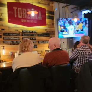 people sitting at a bar