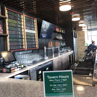 a bar with a menu on the counter