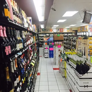a wide aisle in a liquor store