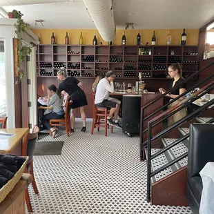 people sitting at tables in a restaurant