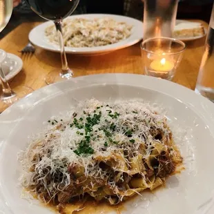 a plate of pasta and a glass of wine