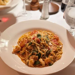 Spaghetti alla Chitarra e gamberi: Guitar Spaghetti with shrimp and arugula in light tomato sauce