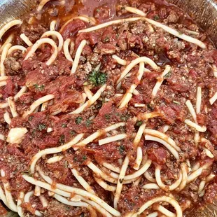 Delicious to-go order of spaghetti bolognese.