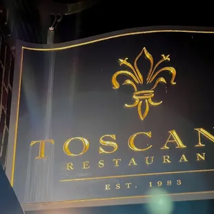 a sign for toscano restaurant