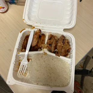 chicken and rice in a styrofoam container