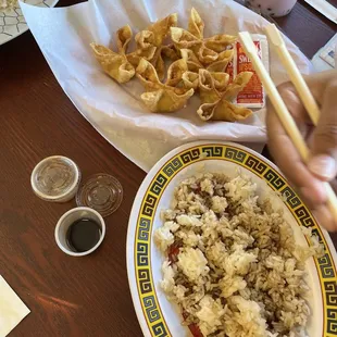 Crab rangoon and white rice with teriyaki sauce