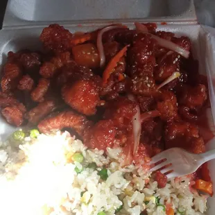 Takeout of the sweet and sour chicken with fried rice.