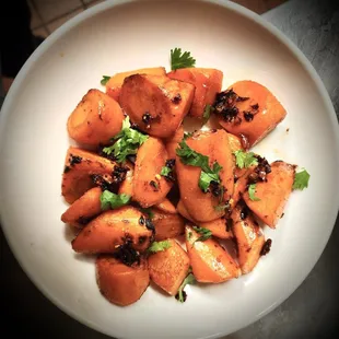 a plate of cooked carrots