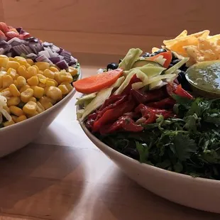 two bowls of food on a table