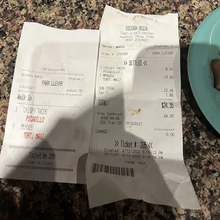 a receipt and a plate of food