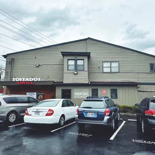 a parking lot in front of a restaurant