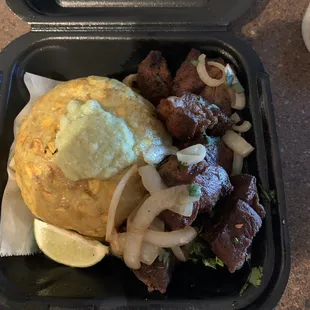 Mofongo with carne frita (fried pork)