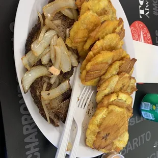 Steak and onions and tostones