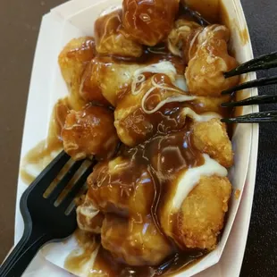$6 Meh Poutine tots. Tiny portion of reg freezer tots. Nothing special. Worse is just melt cheese instead of curds. Blah gravy.