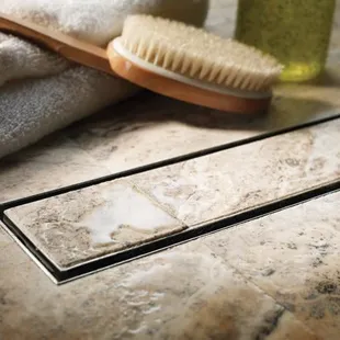 Linear Drain!  One slope in the shower floor!