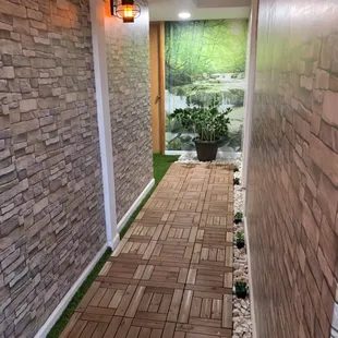 Enter the Zen hallway that leads to our Float Oasis &amp; Sauna!