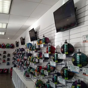 Hundreds of bowling balls with videos playing above