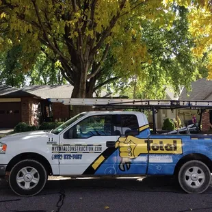 a truck parked in front of a house
