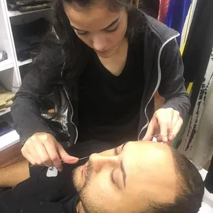 Esthetician... threading is popular. Brow studio.