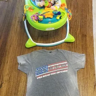 Sweaty Total Nutrition shirt with my baby looking at Daddy's hard work!