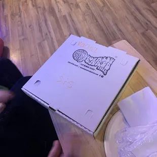 a pizza box on a table