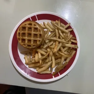 Chicken and waffle slider with half of the fries.