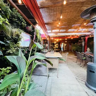 a patio with tables and chairs