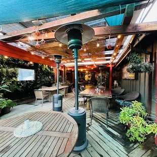 a patio with tables and chairs