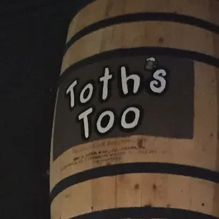 a wooden barrel with the words toth&apos;s too written on it