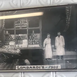 Old photograph of Antonio "Totonno" Pero (left) with Gennaro Lombardi (right) outside of Lombardi's Coal Oven Pizzeria in 1905.
