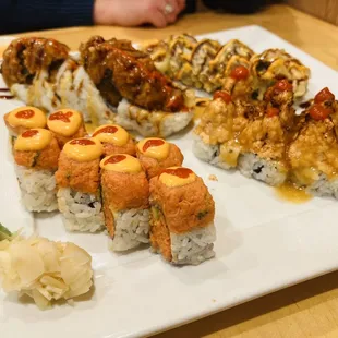 Volcano Roll (Lower left), Salmon on the Beach Roll (Lower right), Heart Attack Roll (Upper left), Yam Yam Roll (Upper right)
