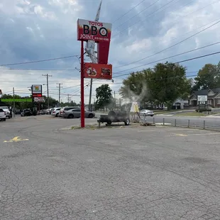 Sign and smoker