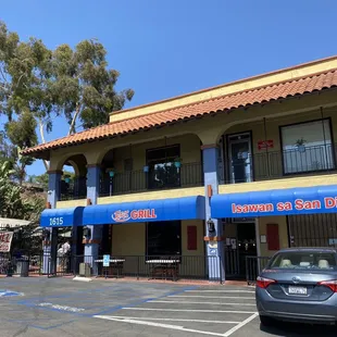 a car parked in front of a restaurant