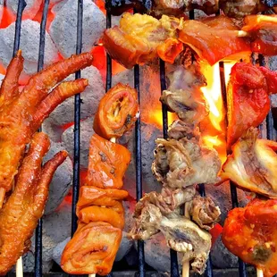 a variety of meats on skewers