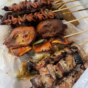 pork bbqs, isaw, chicken heads, sesame balls, tenga (pork ears), vegetable lumpias