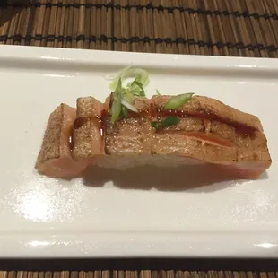 Salmon Toro. Medium cut, not super oily but super delicious none the less. Torched and topped with scallion