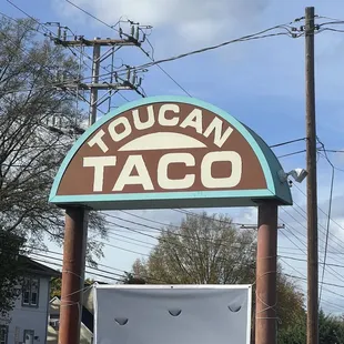 a sign for toucan taco